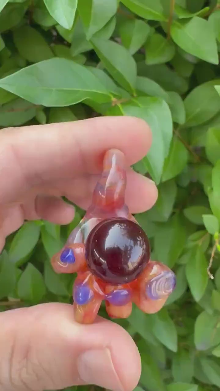 Early Hand holding Orb Pendant